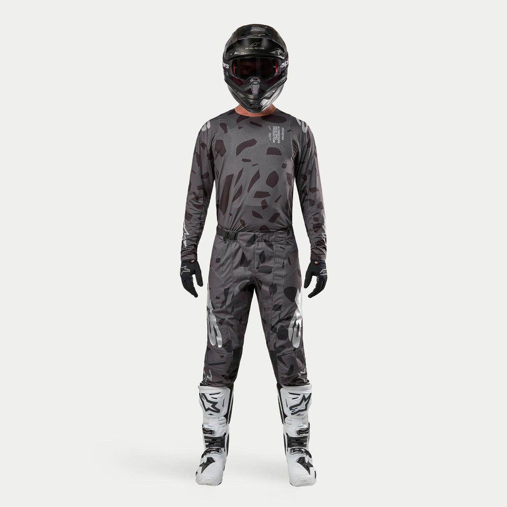 Alpinestars 2024 Techstar Graphite Jersey, Men's Motocross Gear, Black Camo patterns with matching pants and white boots.