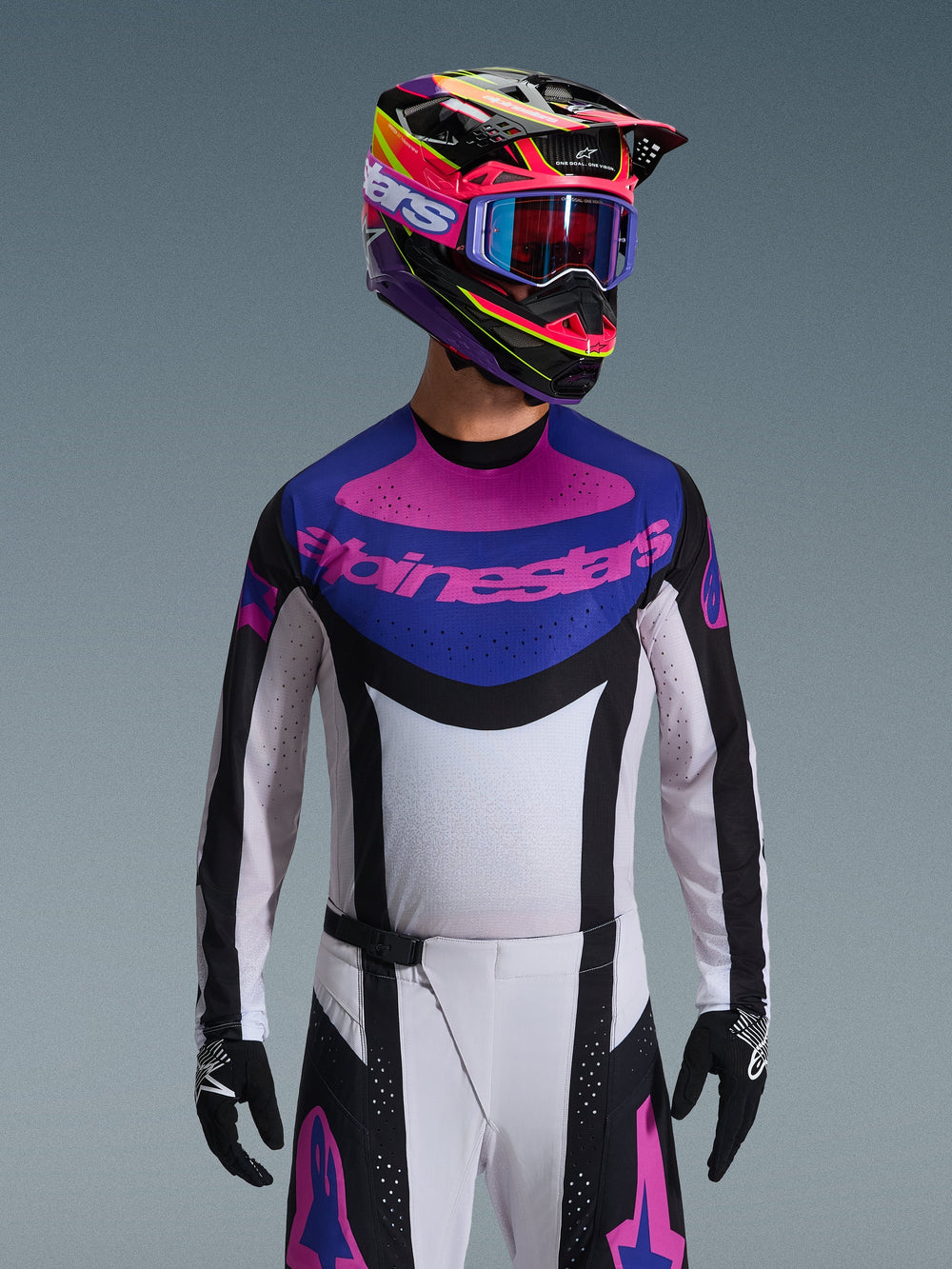 Alpinestars 2026 Techstar Knif Jersey, Motocross Jersey, Black Light Gray and Purple, pink Alpinestars logo on the chest, worn with matching colorful helmet and motocross pants, athletic race fit with laser-cut perforations for ventilation