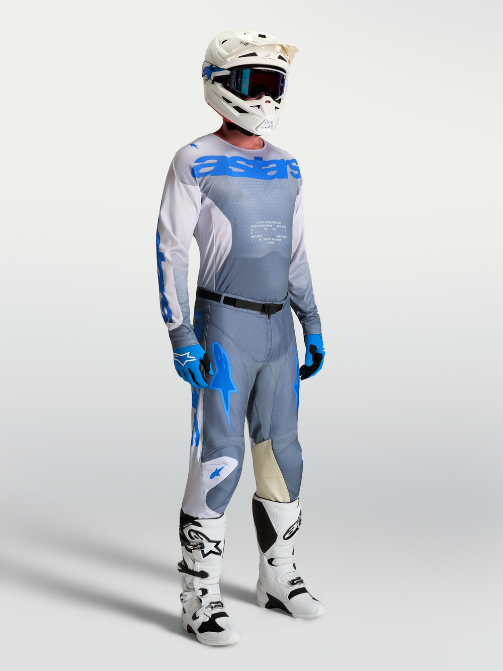 Alpinestars 2027 Racer Amber Jersey, Men's Motocross gear in Ash Gray and UCLA Blue with breathable mesh and matching pants.