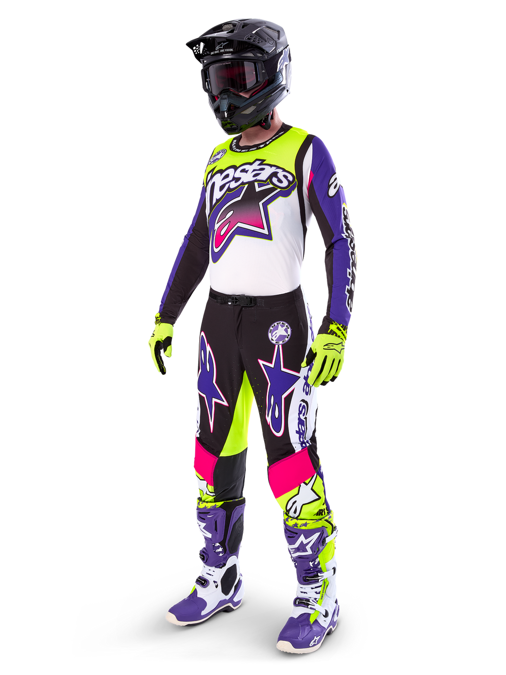 Motocross rider wearing Alpinestars Limited Edition Supertech Dirt Studios® gear, White Purple and Yellow Fluo color scheme, black pants with bold purple and pink star logos, neon yellow gloves, purple and white racing boots, black helmet, complete professional racing kit for off-road performance