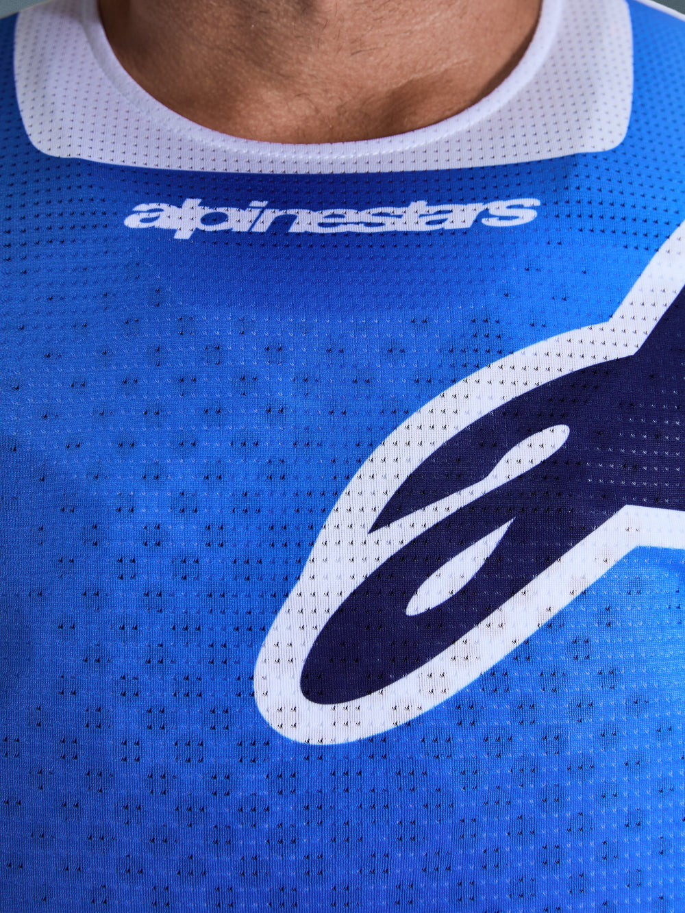 Alpinestars 2026 Racer Air Portl Jersey, Motocross Jersey, Ucla Blue and White, close-up of chest showing breathable perforated mesh fabric, white collar trim, and stylized Alpinestars logos