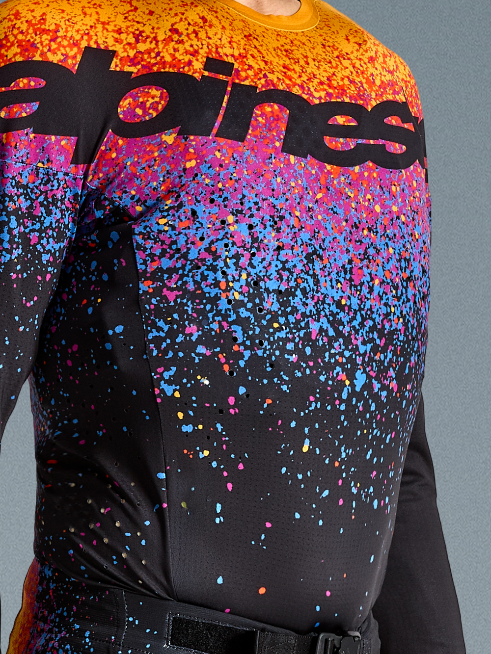 Alpinestars Supertech Black Hole Jersey, Men's Motocross Top, Black with vibrant orange and purple cosmic graphics.