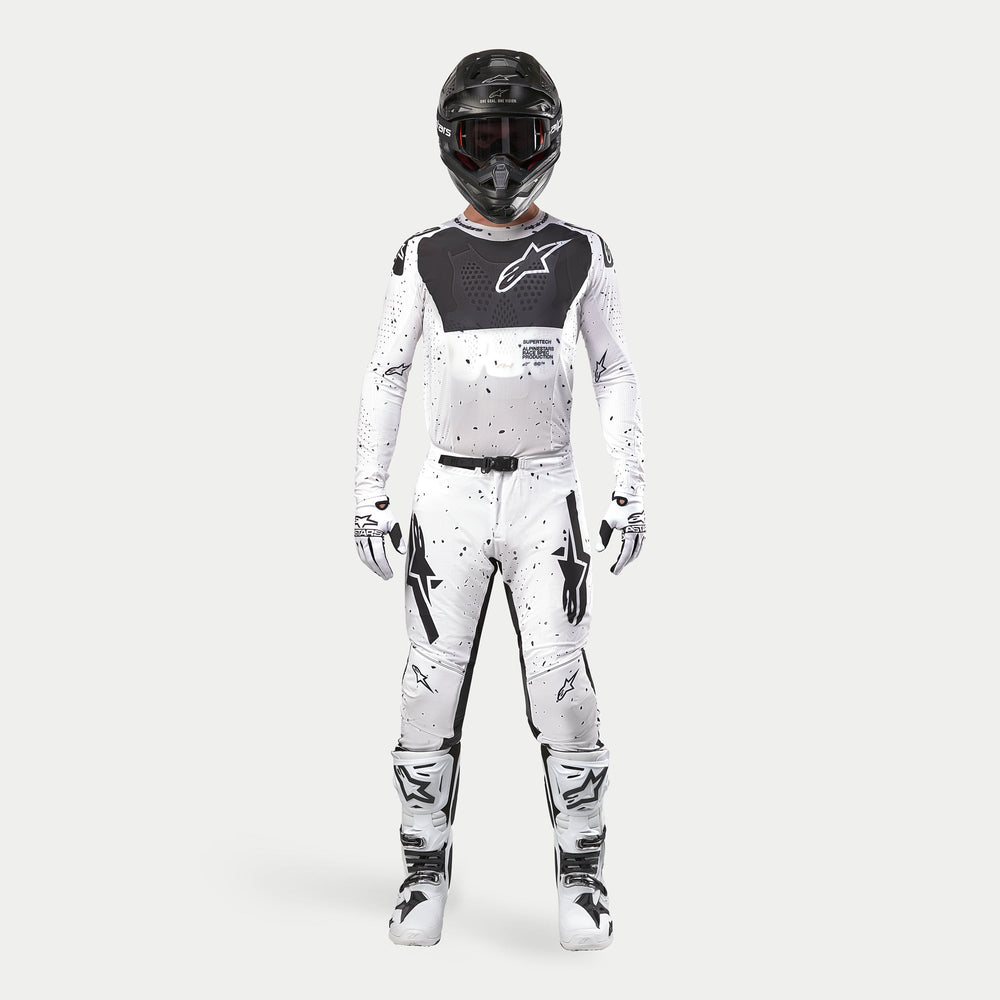 Alpinestars 2024 Supertech Spek Jersey, White and Black Motocross Gear, Men's Off-Road Racing Outfit featuring splatter graphics.