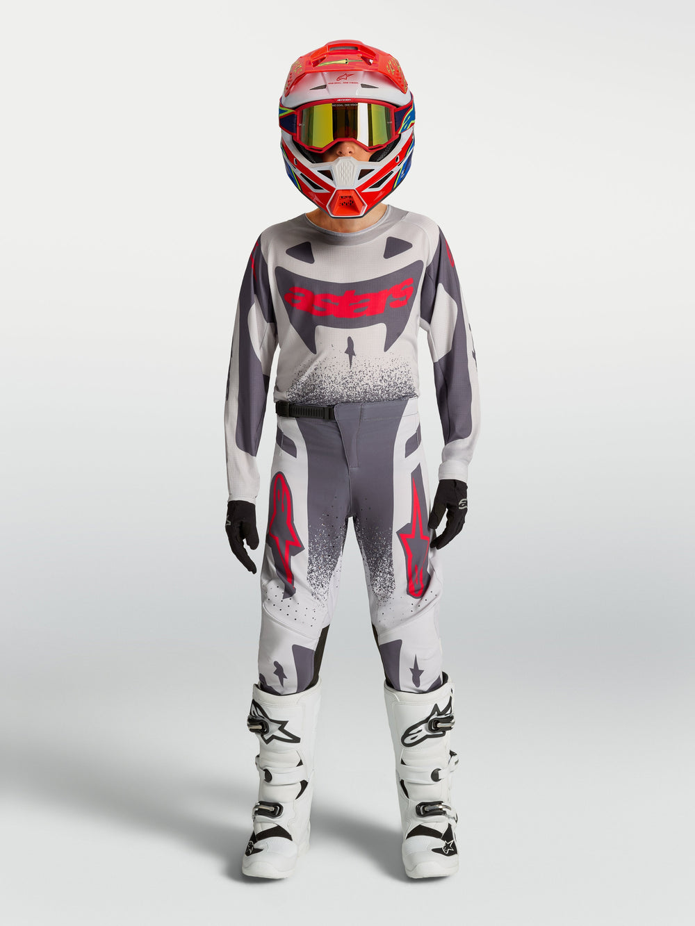 Alpinestars 2027 Youth Supertech Swan Jersey and Gear Set, gray and white motocross racing outfit with red accents.
