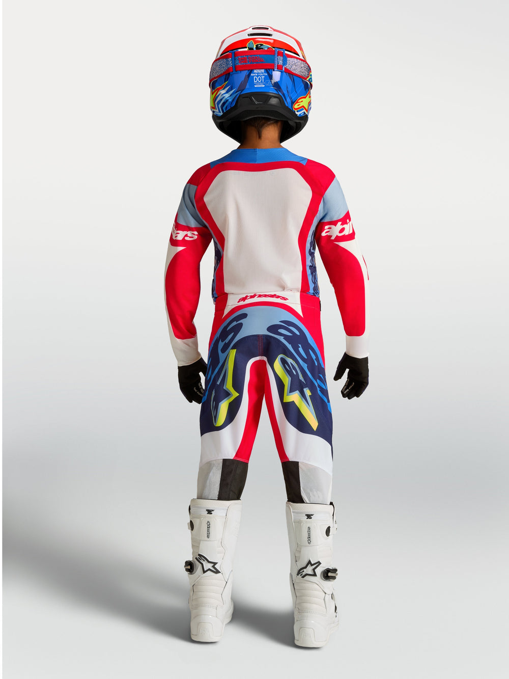 Alpinestars Youth Supertech Dyna Jersey and Gear Set, Fire Red and Navy Blue motocross racing outfit, rear view.