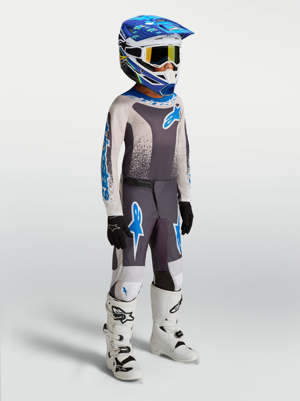 Alpinestars 2027 Youth Fluid Drag Jersey and Gear Set, Graystone and UCLA Blue youth motocross gear with white boots.