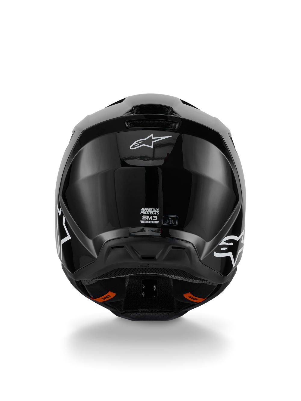 Alpinestars S-M3 Solid Helmet, Motocross Helmet, Glossy Black finish, rear view featuring white Alpinestars logo, ECE 22.06 certification label, and aerodynamic shell with exhaust ports