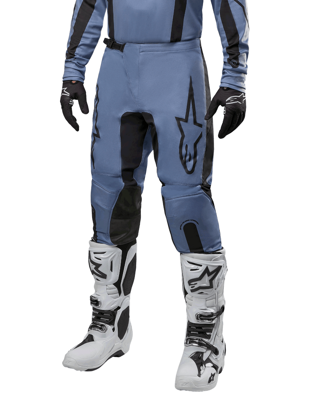 Alpinestars 2024 Fluid Lurv Pants, Motocross Pants, Light Blue and Black, worn with matching long-sleeve jersey and white motocross boots, featuring a prominent black star logo on the thigh and reinforced inner knee panels, front view on white background